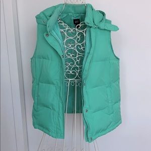 Teal puffy vest with detachable hood and fur trim